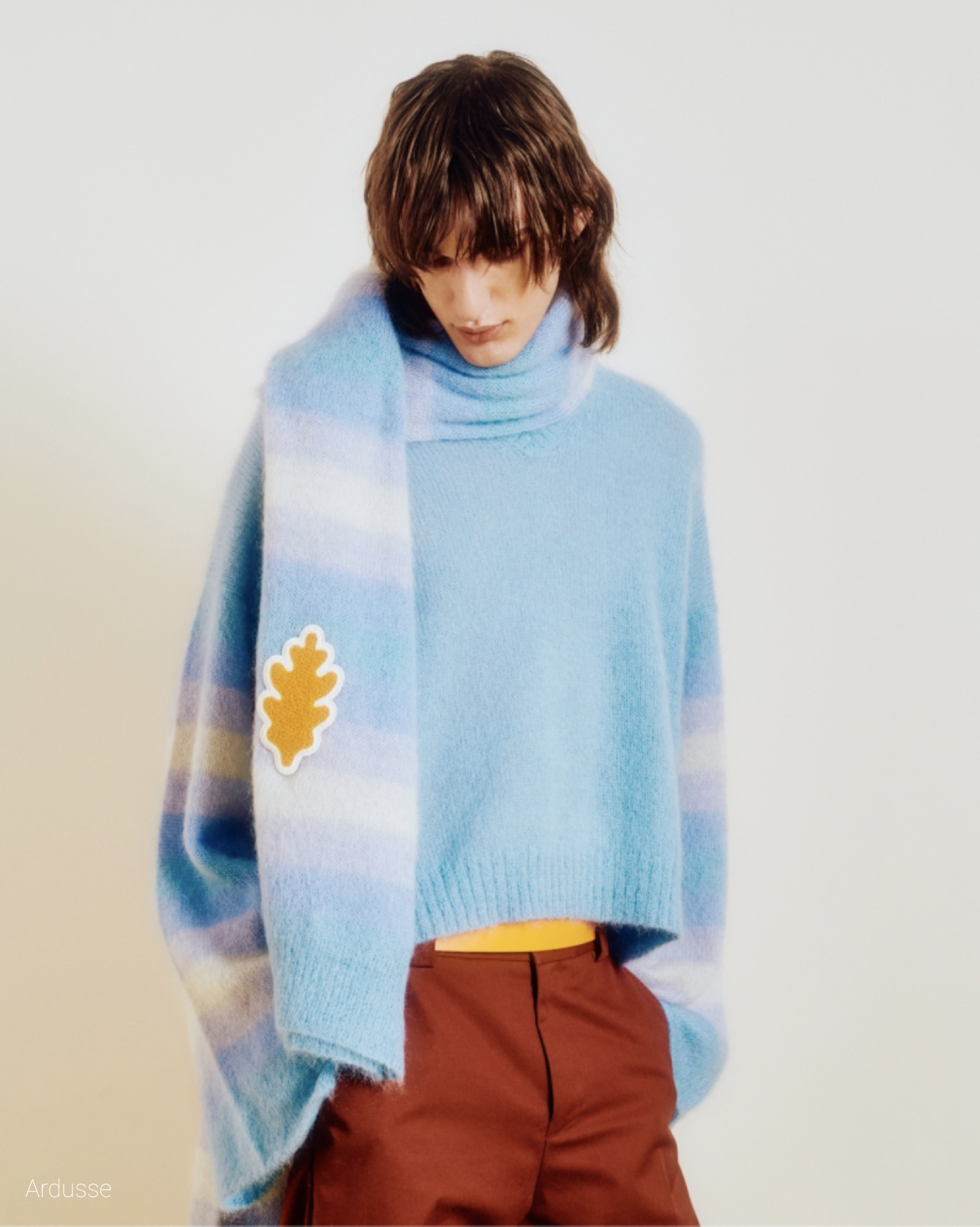 Model poses in blue pullover for Men's FW22 Ardusse